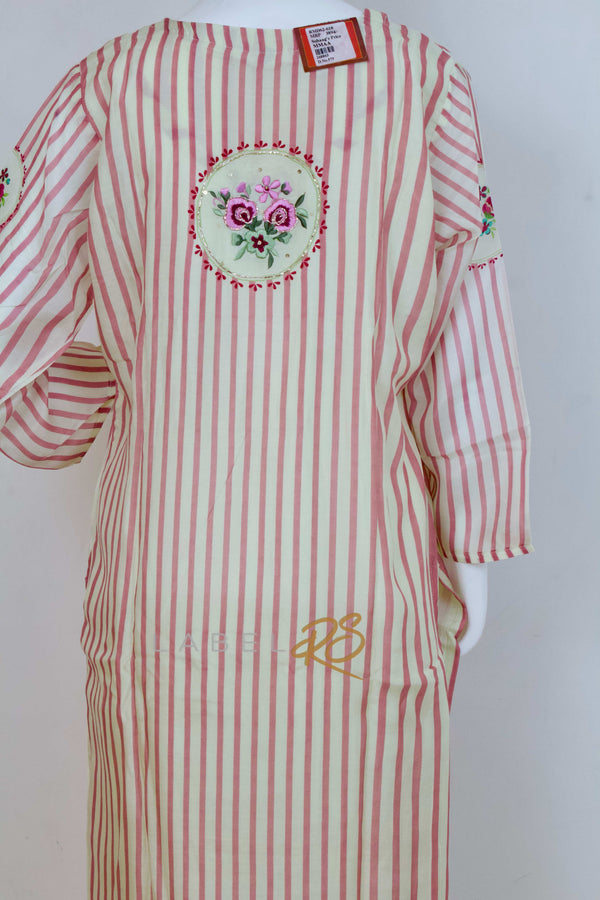 Striped Suit adorned with delicate tassels.